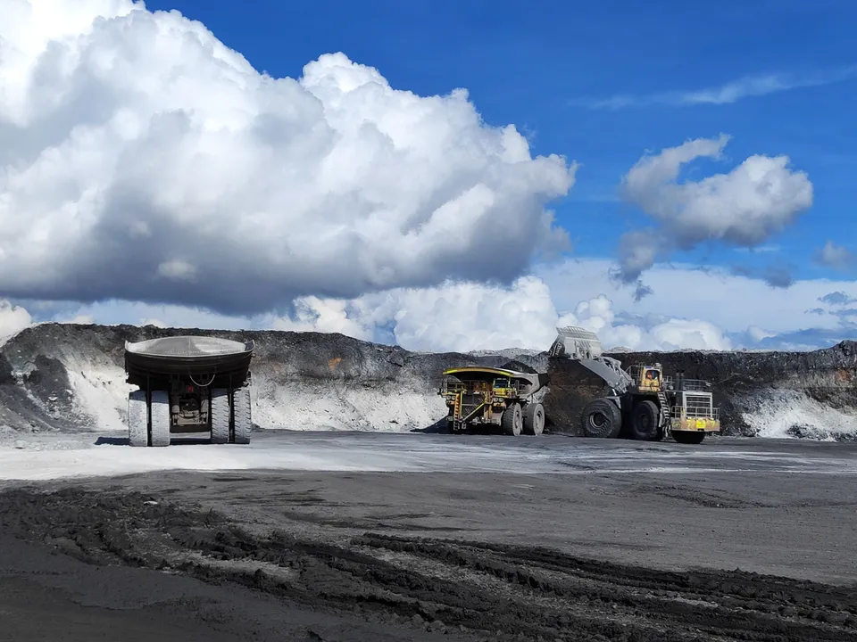 Open-pit mining site with heavy excavation machinery