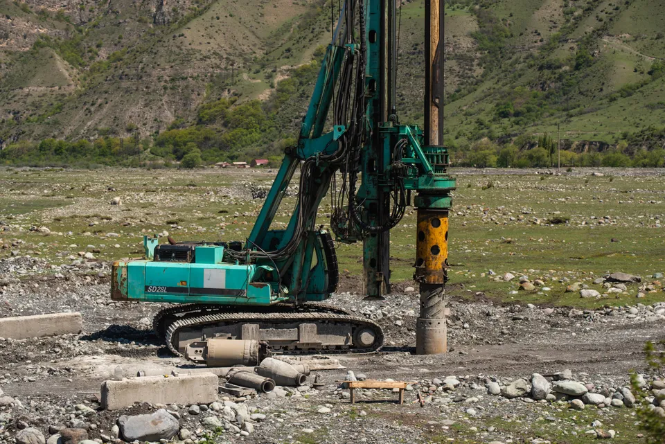 Heavy drilling machinery operating outdoors